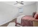 Comfortable bedroom featuring a plush bed, hardwood floors, and closet space at 5488 Janice Ln, Stone Mountain, GA 30087