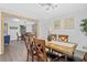 Inviting dining area with rustic table, modern light fixture, and decorative wall art at 5488 Janice Ln, Stone Mountain, GA 30087