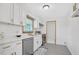 Modern kitchen boasts white cabinetry, stainless steel appliances, and quartz countertops at 5488 Janice Ln, Stone Mountain, GA 30087