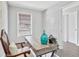 Office space with a rustic desk, a chair with patterned cushion, and wood-look floors at 5488 Janice Ln, Stone Mountain, GA 30087