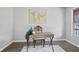 Office space with a rustic desk and a hanging world map, providing a unique aesthetic at 5488 Janice Ln, Stone Mountain, GA 30087