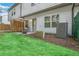 Landscaped backyard, patio, and green lawn at 1363 Cooper Springs Rd, Grayson, GA 30017