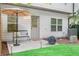 Cozy backyard patio with seating area and privacy fence at 1363 Cooper Springs Rd, Grayson, GA 30017