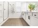 Bathroom features a walk-in shower, double vanity, and modern fixtures at 1363 Cooper Springs Rd, Grayson, GA 30017