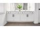 Modern bathroom featuring a double vanity with dark hardware and light fixtures at 1363 Cooper Springs Rd, Grayson, GA 30017