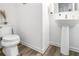 Clean half-bathroom with pedestal sink, toilet, and neutral walls at 1363 Cooper Springs Rd, Grayson, GA 30017