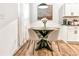Charming dining area with modern round table and decor underneath a pendant light at 1363 Cooper Springs Rd, Grayson, GA 30017