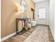 Warm entryway with wood floors, stylish console table, and decor for a welcoming ambiance at 1363 Cooper Springs Rd, Grayson, GA 30017