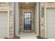 Inviting front entrance with a black door framed by stone accents and featuring house number signage at 1363 Cooper Springs Rd, Grayson, GA 30017