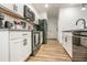 Bright kitchen featuring stainless steel appliances, white cabinetry and granite countertops at 1363 Cooper Springs Rd, Grayson, GA 30017