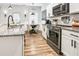 Updated kitchen featuring stainless appliances, granite counters, and a cozy breakfast nook at 1363 Cooper Springs Rd, Grayson, GA 30017