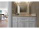 Modern powder room featuring white vanity with stone countertop and updated fixtures at 1894 Dyer Cir, Atlanta, GA 30341