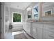 Serene bathroom with dual vanities, soaking tub, and separate glass shower at 1894 Dyer Cir, Atlanta, GA 30341