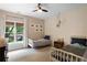 Inviting bedroom with two twin beds, patterned wallpaper, and stylish decor at 1894 Dyer Cir, Atlanta, GA 30341
