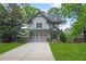 Charming two-story home with well-manicured lawn, driveway, and lovely architectural details at 1894 Dyer Cir, Atlanta, GA 30341