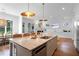 Large kitchen island with bar stool seating, stainless appliances, and open access to living area at 1894 Dyer Cir, Atlanta, GA 30341