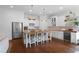 Stylish kitchen with stainless steel appliances, an island with seating, and modern lighting fixtures at 1894 Dyer Cir, Atlanta, GA 30341