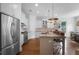 Spacious kitchen boasts an island with barstool seating, stainless steel appliances, and ample cabinet space at 1894 Dyer Cir, Atlanta, GA 30341