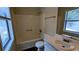 Bathroom featuring a shower/tub combo, toilet, and single sink vanity at 2015 Corners Cir, Lithonia, GA 30058