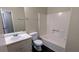 Bathroom featuring a shower/tub combo, single sink vanity and wood-look floors at 2015 Corners Cir, Lithonia, GA 30058