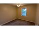 Bedroom featuring carpet flooring, one window and neutral colored walls at 2015 Corners Cir, Lithonia, GA 30058
