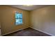 Bedroom featuring carpet flooring, one window and neutral colored walls at 2015 Corners Cir, Lithonia, GA 30058