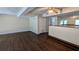 The living room features a bar, neutral walls and wood-look floors at 2015 Corners Cir, Lithonia, GA 30058