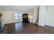 Open living room area with hardwood floors, staircase, and natural light at 2015 Corners Cir, Lithonia, GA 30058