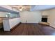 Spacious living room featuring a brick fireplace and wood-look flooring at 2015 Corners Cir, Lithonia, GA 30058