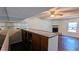 View of the living room featuring a bar, fireplace and ceiling fan at 2015 Corners Cir, Lithonia, GA 30058
