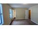View of main bedroom with carpet flooring and an ensuite bathroom at 2015 Corners Cir, Lithonia, GA 30058
