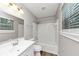 Clean bathroom with white subway tiles, updated fixtures, and natural lighting at 3130 Glen Knolls Ct, Alpharetta, GA 30022