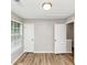 A bedroom with hardwood floors, gray walls, and two closets at 3130 Glen Knolls Ct, Alpharetta, GA 30022