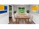 Formal dining room with modern decor, including a stylish table set and updated floors at 3130 Glen Knolls Ct, Alpharetta, GA 30022