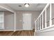 Inviting foyer featuring new laminate flooring and a staircase, enhancing the entrance appeal at 3130 Glen Knolls Ct, Alpharetta, GA 30022