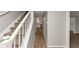 Hallway featuring new laminate flooring, leading to a kitchen with stainless steel appliances at 3130 Glen Knolls Ct, Alpharetta, GA 30022