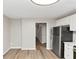 A modern kitchen with stainless steel appliances, white cabinets and countertops, and hardwood floors at 3130 Glen Knolls Ct, Alpharetta, GA 30022