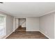 Living room with hardwood floors, lots of light and a view of the home's staircase at 3130 Glen Knolls Ct, Alpharetta, GA 30022