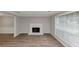 Living room features include a cozy fireplace and plenty of natural light at 3130 Glen Knolls Ct, Alpharetta, GA 30022