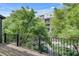 Wooden balcony overlooking a leafy courtyard at 345 Glen Iris Ne Dr # 3, Atlanta, GA 30312