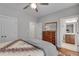 Spacious bedroom with hardwood floors, ceiling fan, and ensuite bathroom at 345 Glen Iris Ne Dr # 3, Atlanta, GA 30312