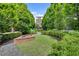 Serene courtyard featuring a brick fire pit and lush landscaping at 345 Glen Iris Ne Dr # 3, Atlanta, GA 30312