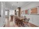 Dining room with wood table and chairs, view into the open kitchen with island at 345 Glen Iris Ne Dr # 3, Atlanta, GA 30312