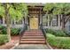 Inviting front entryway with brick stairs, stone accents, and bright yellow door at 345 Glen Iris Ne Dr # 3, Atlanta, GA 30312