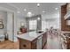 Open kitchen with stone counters and stainless appliances, adjacent to a table with chairs by window at 345 Glen Iris Ne Dr # 3, Atlanta, GA 30312