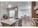 Well-lit kitchen with stainless appliances, stone countertops, and seating area near a large window at 345 Glen Iris Ne Dr # 3, Atlanta, GA 30312
