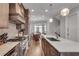Modern kitchen with stainless steel appliances, center island with quartz countertops, and a spacious dining area at 345 Glen Iris Ne Dr # 3, Atlanta, GA 30312