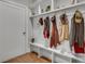 Mudroom with built-in bench, coat hooks, upper shelving and interior door at 345 Glen Iris Ne Dr # 3, Atlanta, GA 30312
