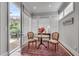 Small table and chairs are set near a bright window at 345 Glen Iris Ne Dr # 3, Atlanta, GA 30312