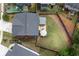 Aerial view of a home showcasing a backyard with a covered patio, landscaping, and privacy fence at 382 Winston Circle Cir, Canton, GA 30114